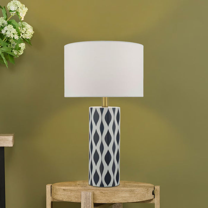 Weylin table lamp with navy and white glazed ceramic base and white faux silk shade