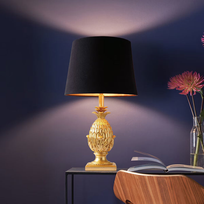 Pineapple table lamp with gold resin base and black satin drum shade with gold lining