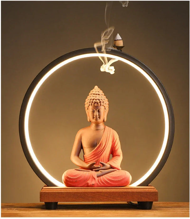Ceramic Sakyamuni Buddha backflow incense burner with LED lamp and waterfall smoke effect for meditation and home décor.