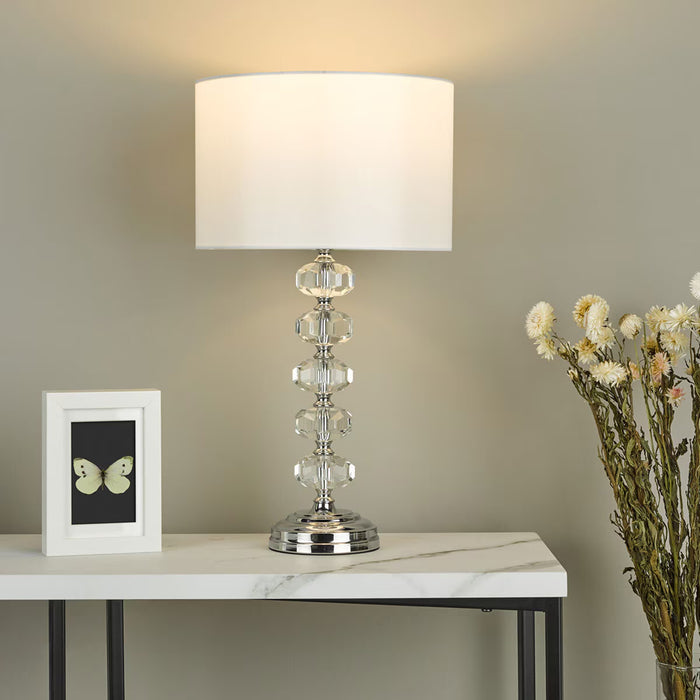 Oleana table lamp with crystal glass beaded base, polished chrome frame, and ivory faux silk shade