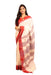 Elegant Kotpad saree handwoven in Odisha with natural Aul tree dyes, tribal motifs, and matching blouse piece