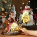 Lighted Christmas Cabin Music Box with LED Santa, Snowman, and Rotating Train
