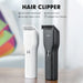 Cordless hair trimmer with dual-speed motor, rounded stainless steel blades, and USB-C charging cable shown on a grooming countertop

