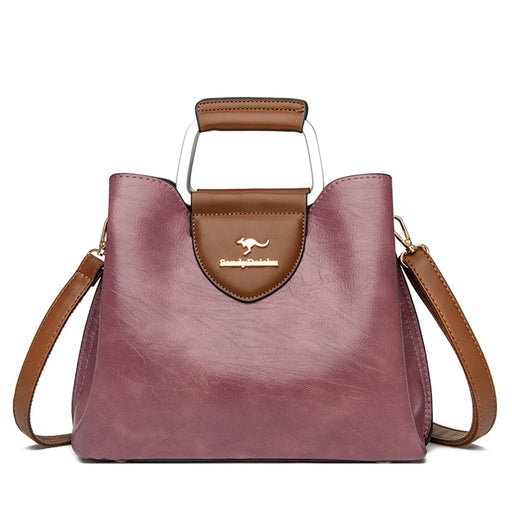Casual tote handbag made from microfiber synthetic leather with zipper closure and multiple storage compartments.