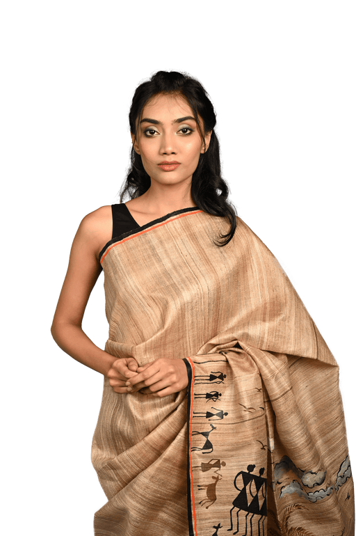 Handwoven Tussar Silk Saree with Warli tribal art showcasing geometric motifs and traditional Indian designs