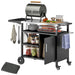 Outsunny stainless steel BBQ trolley in black with folding prep table, storage shelves, and wheels – outdoor cooking station for UK patios

