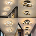Modern round LED ceiling light with black aluminum body and acrylic shade