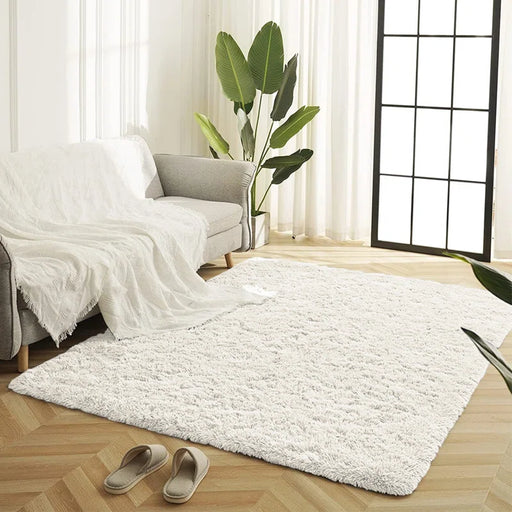 Luxuriously soft cream shag rug with deep pile, perfect for cozy living spaces.

