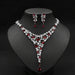 Gold-plated red ruby necklace set with cubic zirconia stones for women, elegant jewelry on white background