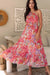 Woman wearing a smocked tiered maxi dress in flowy polyester fabric – UK sizes 8 to 18