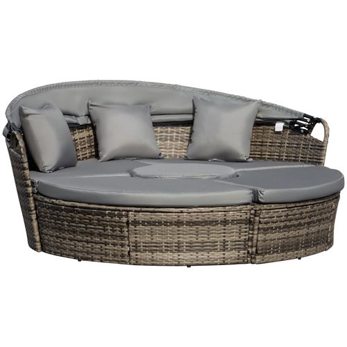 4-piece outdoor rattan daybed set with canopy and cushions on a garden patio

